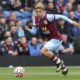 Burnley winger Manuel Benson sprints down the wing during a match.