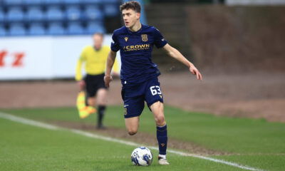 Owen Beck playing for Dundee, showcasing his skills on the left wing.