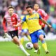 Stoke City's winger Million Manhoef on the pitch, demonstrating his agility and pace.