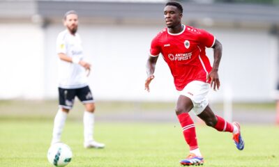 Mandela Keita in action during a football match, demonstrating his skills as a midfielder.